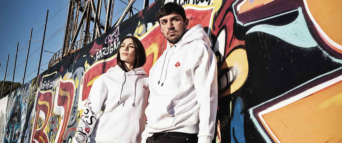 couple wearing pokerstars merchandise. photo - pokerstars