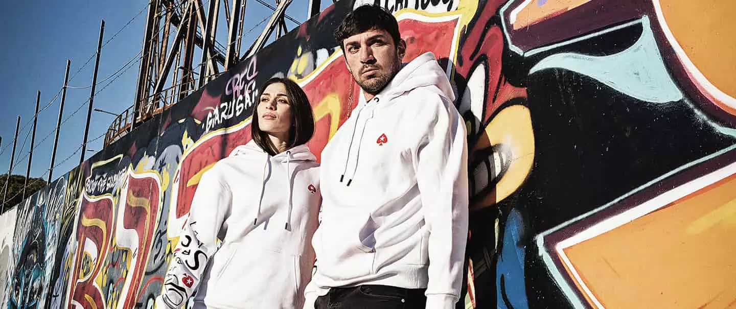 couple wearing pokerstars merchandise. photo - pokerstars Image