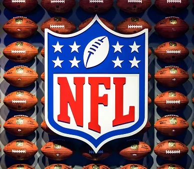 nfl logo on background of footballs